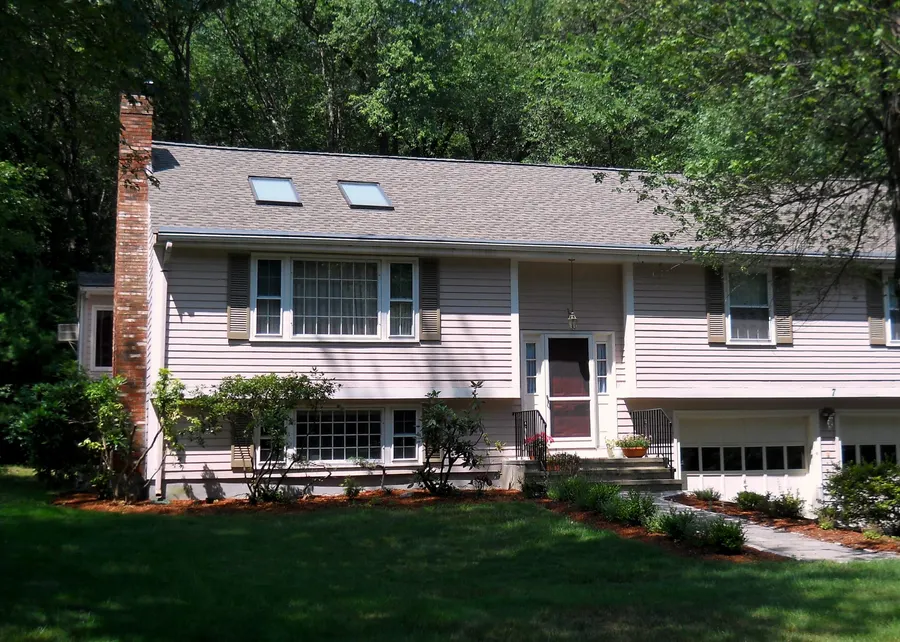 Split-level home with a newly shingled roof and two replacement skylights